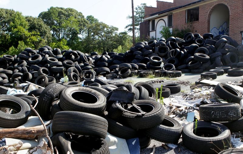 A tire dump in Atlanta photographed in 2020. While the Environmental Protection Agency recognizes tire scraps as a viable alternative to fossil fuels, environmentalists have raised pollution concerns about burning the material. (PHIL SKINNER)
