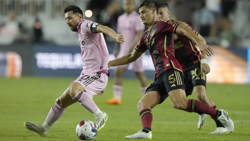 Atlanta United midfielder Santiago Sosa (5) defends Inter Miami forward Lionel Messi (10) during the second half of a Leagues Cup soccer match, Tuesday, July 25, 2023, in Fort Lauderdale, Fla. (AP Photo/Lynne Sladky)