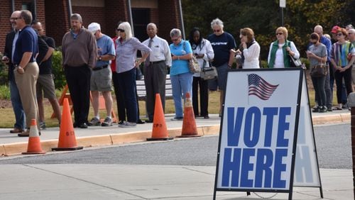 Early voters wait outside George Pierce Park Community Recreation Center in Suwanee on Wednesday, October 26, 2016. Current wait time was 2 hours. Georgia, which is nearing 1 million ballots cast during the state’s early voting period, will open its polls this Saturday for a mandatory weekend voting day ahead of the Nov. 8 presidential election. In the last presidential election, nearly 2 million people in Georgia cast early ballots ahead of Election Day — almost half of all ballots cast in that election. HYOSUB SHIN / HSHIN@AJC.COM