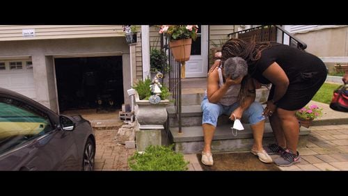 Mt. Vernon, New York homeowner Linda McNeil who has had to clean raw sewage out of her home countless times over the past two decades because of the city's crumbling sewer system, is comforted by her daughter in a still image from the documentary series "Wasteland."