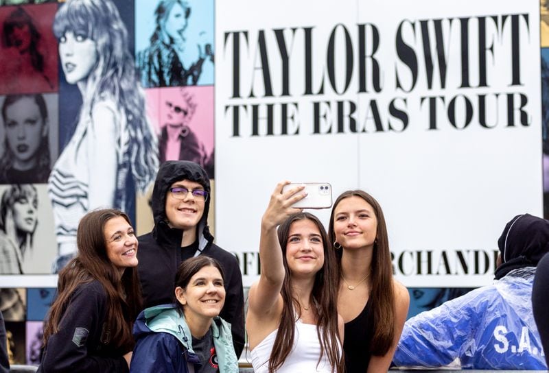 Bella Peet of Navarre, Florida takes a selfie while in line for Taylor Swift merchandise in front of Mercedes-Benz stadium in Atlanta on Thursday, April 27, 2023. (Arvin Temkar / arvin.temkar@ajc.com)