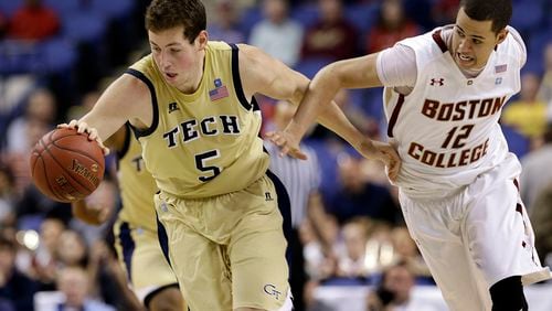Tech's Daniel Miller (5) and Boston College's Ryan Anderson (12) chase a loose ball in the opening game of the ACC Tournament in Greensboro, N.C.