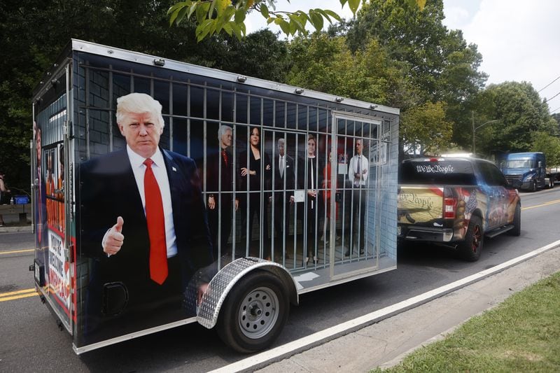 A Trump truck drivers pass as supporters protest outside of the Fulton County Jail the day Trump plans to be booked on Thursday, August 24, 2023 in Atlanta. (Michael Blackshire/Michael.blackshire@ajc.com)