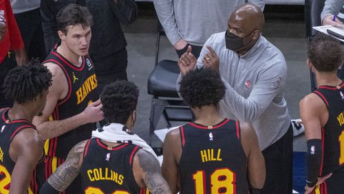 Hawks assistant coach Nate McMillan - standing for coach Lloyd Pierce - speaks with the team during a time out against the Denver Nuggets during the second quarter Sunday, Feb. 21, 2021, at State Farm Arena in Atlanta. (Alyssa Pointer / Alyssa.Pointer@ajc.com)