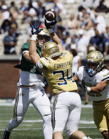 Georgia Tech quarterback Graham Knowles (14) has a pass tipped by Georgia Tech linebacker Myles Forristall (34) during the Spring White and Gold game at Bobby Dodd Stadium at Hyundai Field In Atlanta on Saturday, April 13, 2024.   (Bob Andres for the Atlanta Journal Constitution)