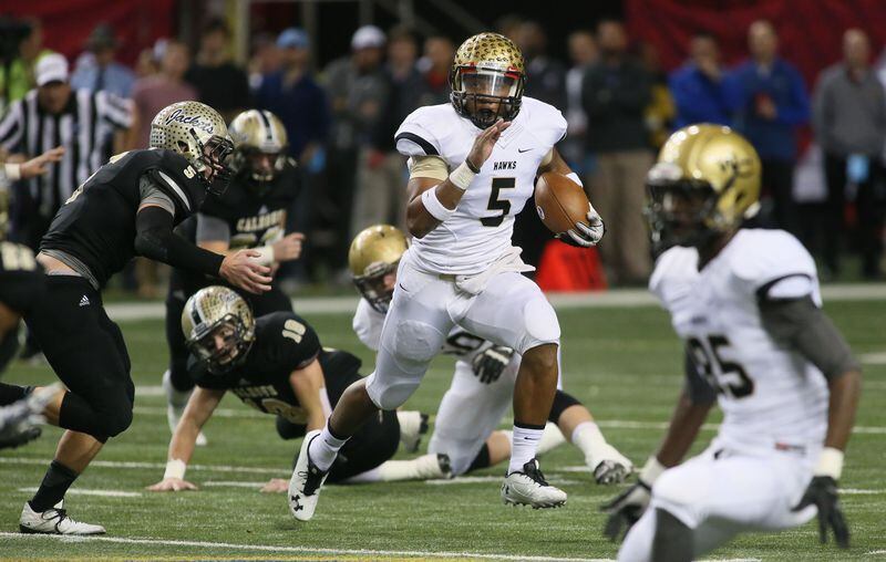 December 12, 2014-ATLANTA:Washington County's quarterback #5 A.J. Gray runs a keeper play during their Georgia High School Association AAA Football state championship game against the Calhoun Yellow Jackets at the Georgia Dome on Friday December 12th, 2014. (Photo by Phil Skinner) Georgia Tech coach Paul Johnson believes that AJC state player of the year and Parade All-American A.J. Gray should have been rated higher than a three-star prospect. (AJC photo by Phil Skinner)