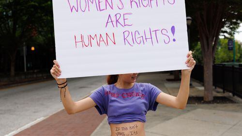 Abortion rights activists rally at Centennial Olympic Park in Atlanta on Sunday, June 26, 2022. (Arvin Temkar / arvin.temkar@ajc.com)