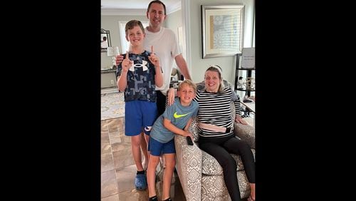 As Rachel Blackman battles a mystery illness, she remains steadfast in her role as a mother to sons Peyton, 11, and Cameron, 7, shown with their dad and her husband Brad.