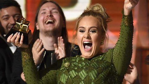 Adele veered from tears to laughter while accepting her album of the year Grammy for "25," moments after winning record of the year for "Hello." (Photo by Kevork Djansezian/Getty Images)