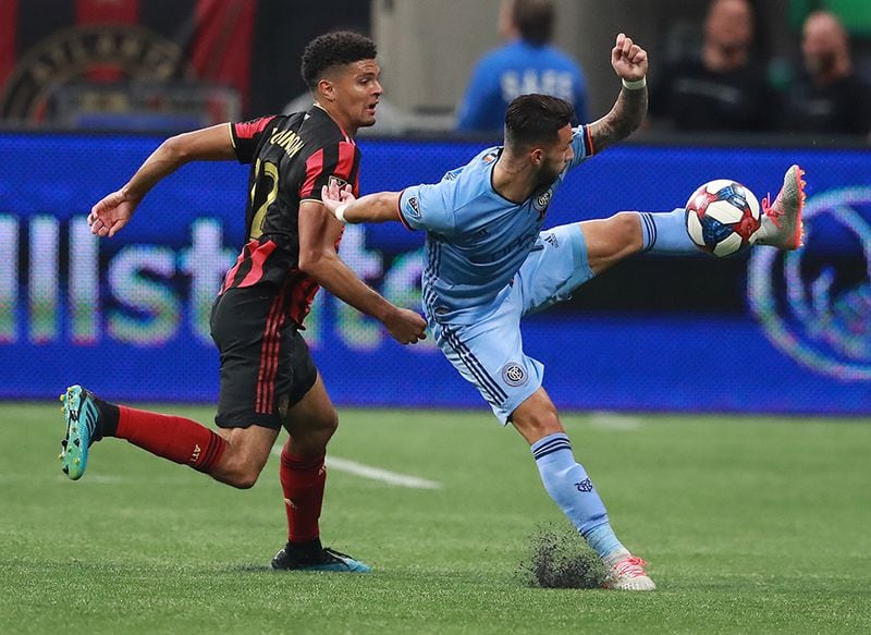 Atlanta United's Miles Robinson defends against New York City FC forward Valentin Castellanos Sunday, Aug. 11, 2019, at Mercedes-Benz Stadium in Atlanta.