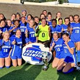 Chamblee players and coaches celebrate their 9-0 victory over Greenbrier in the Class 5A girls soccer championship game on May 4, 2023, and Duluth HIgh School.