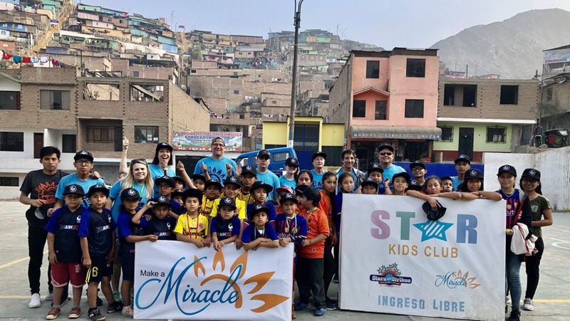 Make a Miracle also sponsors Star Kids Clubs. More than 130 children from San Juan de Lurigancho, Lima, Peru, have participated in clubs with games, teaching and worship. The scholarship students are volunteer helpers.  Courtesy of Make a Miracle.