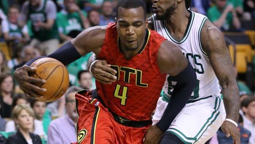 Hawks’ Paul Millsap drives around Celtics’ Jae Crowder during the third period in Game 6 of an NBA basketball first-round playoff series at TD Garden on Thursday, April 28, 2016, in Boston. Curtis Compton / ccompton@ajc.com