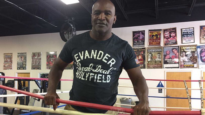 Evander Holyfield, the former longtime Atlanta resident seen in this May 2017 photo, stands in the ring at The Heavyweight Factory in Fort Lauderdale, Fla., where he still works out and shadow boxes.