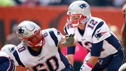 New England Patriots' Tom Brady and center David Andrews play against the Cleveland Browns during the first half of an NFL football game in Cleveland.   (AP Photo/Ron Schwane, File)