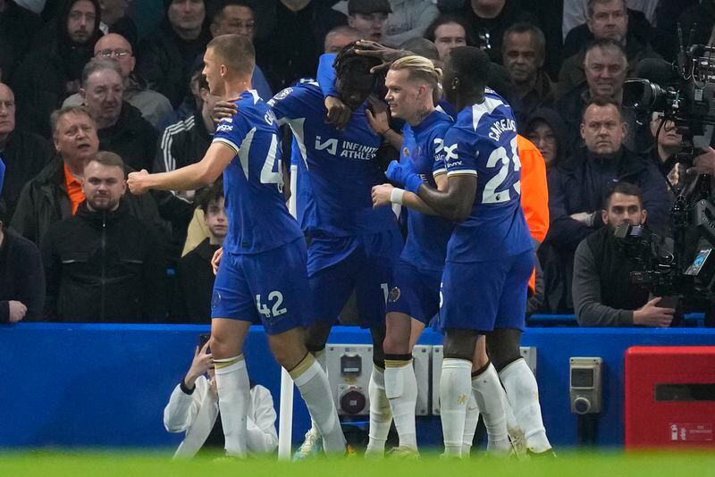 Chelsea's Trevoh Chalobah, centre, celebrates after scoring his side's opening goal during the English Premier League soccer match between Chelsea and Tottenham Hotspur at Stamford Bridge stadium in London, Thursday, May 2, 2024. (AP Photo/Kirsty Wigglesworth)