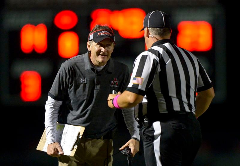 Allatoona head coach Gary Varner talks with a referee after a call in the second half of his game against Hapeville Charter Friday, October 12, 2018 at Allatoona High School. PHOTO/Daniel Varnado