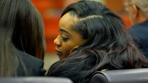 Rockell Coleman pleaded guilty to involuntary manslaughter charges in the a 2014 house fire that killed three of her sons. In this January 2015 photo, Coleman reacts to a DeKalb County Superior Court judge's ruling that she cannot see her surviving children before or during the case.