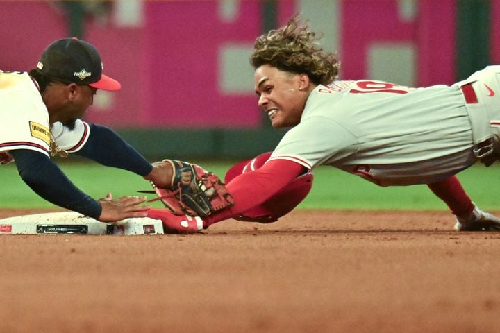 Atlanta Braves second baseman Ozzie Albies (1) applies the late tag as Philadelphia Phillies’ Cristian Pache (19) safely steals second base during the fifth inning of NLDS Game 2 in Atlanta on Monday, Oct. 9, 2023.   (Hyosub Shin / Hyosub.Shin@ajc.com)