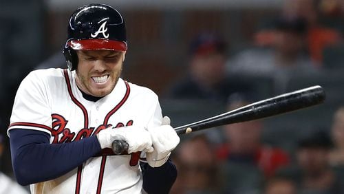 Braves first baseman Freddie Freeman reacts after getting hit by a pitch in the eighth inning Wednesday, April 18, 2018, against the Philadelphia Phillies at SunTrust Park in Atlanta.