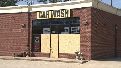 Windows were shot out  of this car wash in Cherokee County. (Credit: Channel 2 Action News)