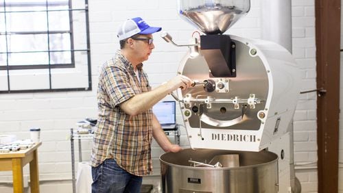 Radio Roasters owner Chip Grabow prepping a coffee order for one of their wholesale partners. (Photo credit: Whitney Ott)