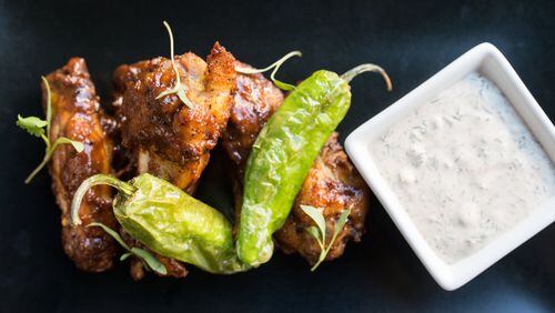 Chicken wings with shishito peppers, chili-garlic sauce, and Amara ranch dressing. CONTRIBUTED BY MIA YAKEL