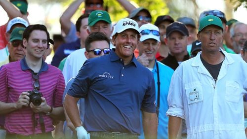 Phil Mickelson cracks a joke to the gallery around the fourth tee during his Tuesday practice round for the Masters. (Curtis Compton/ccompton@ajc.com)