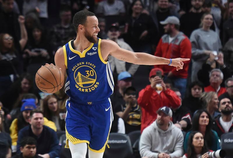 Golden State Warriors guard Stephen Curry smiles, at the end of the team's NBA basketball game against the Portland Trail Blazers in Portland, Ore., Thursday, April 11, 2024. (AP Photo/Steve Dykes)