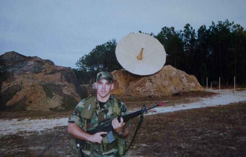 Tyler Bowser, shown in July 2000 on a field deployment at Eglin Air Force Base in Florida, was a satellite and wideband communications journeyman while enlisted. The satellite communications terminal is in the background. CONTRIBUTED BY TYLER BOWSER