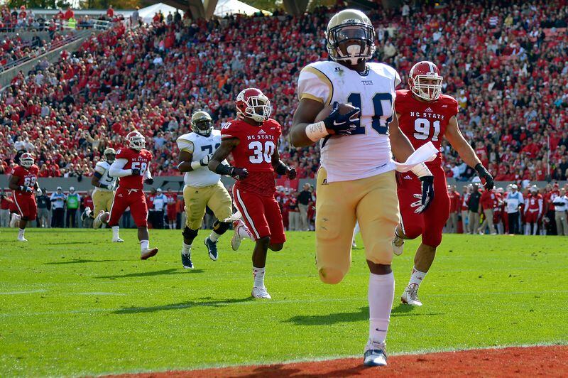 RALEIGH, NC - NOVEMBER 08: Synjyn Days #10 of the Georgia Tech Yellow Jackets breaks away from the North Carolina State Wolfpack defense for a touchdown during their game at Carter-Finley Stadium on November 8, 2014 in Raleigh, North Carolina. (Photo by Grant Halverson/Getty Images) Former Georgia Tech B-back Synjyn Days will begin training with the Cowboys this week. (GETTY IMAGES)