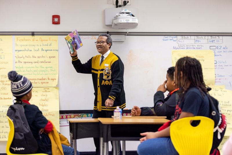 Clyde Mitchell, a member of Alpha Phi Alpha Fraternity's Omicron Phi Lambda chapter based in East Point and a former East Point councilman, reads to third graders at Asa G. Hilliard Elementary School in East Point on Wednesday, March 27, 2024. (Arvin Temkar / arvin.temkar@ajc.com)