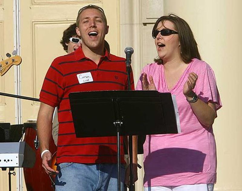 Carson Foushee (left) and Mary Lynne Patillo of the First Baptist Church of Decatur's Fresh Start Worship Team, help provide the musical selections at the outdoor Easter service on the front lawn .