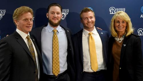 The Los Angeles Rams hired former Atlantan and Marist High School quarterback Sean McVay (second from right) as their new football coach last January. With him were (from left) father Tim McVay, brother Ryan McVay, and mother Cindy McVay .