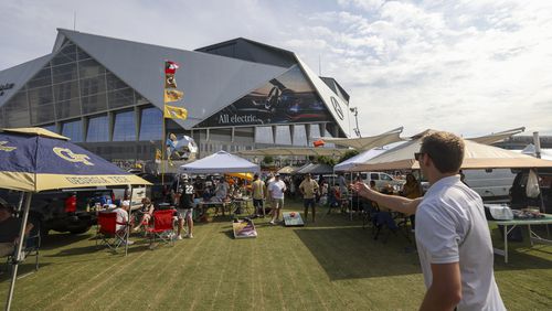 Georgia Tech fans play cornhole at the Home Depot Backyard before Tech’s game against Louisville in the Aflac Kickoff Game at Mercedes-Benz Stadium, Friday, September 1, 2023, in Atlanta. (Jason Getz / Jason.Getz@ajc.com)