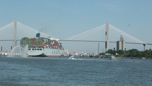The cargo ship Cosco Development passes under the Talmadge Memorial Bridge en route to the Garden City Terminal on the Savannah River in May 2017. J. Scott Trubey/strubey@ajc.com
