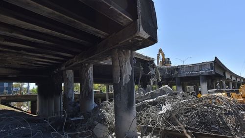 Crews demolish a damaged section of I-85 bridge structures on Saturday, April 1, 2017. Necessary work is continuing on the damaged sections of I-85 bridge structures. This includes demolition of the existing failed and damaged structures - which includes two 350-foot sections of interstate, one section each in both the northbound and southbound lanes, totaling approximately 700 feet - as well as all reconstruction activities. HYOSUB SHIN / HSHIN@AJC.COM