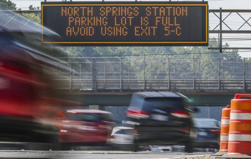 October 3, 2019 Fulton County: A GDOT electronic signboard informs southbound GA 400 commuters that the parking lot is full at the North Springs MARTA Station on Thursday, Oct 3, 2019. MARTA is negotiating with AT&T to buy the parking decks at the busy North Springs station along with Doraville and College Park stations. The lots would open up 2,100 spots to train riders. Those are all the resident-used north and south endpoints of the train. There’s no price, but AT&T has been leasing for land forever. JOHN SPINK/JSPINK@AJC.COM