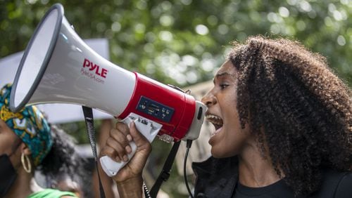 A protestor chants during a peaceful protest march from Cleopas Park to Atlanta City Hall, Sunday, June 7, 2020. (ALYSSA POINTER / ALYSSA.POINTER@AJC.COM)