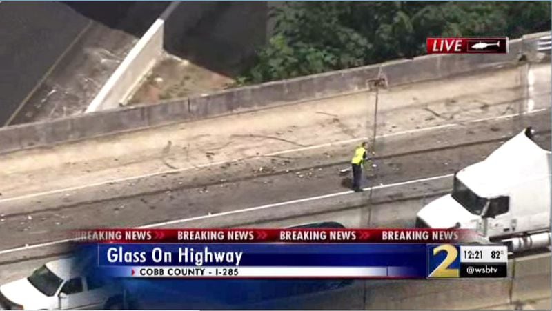 Crews worked to clear the broken glass with brooms and fire hoses. (Credit: Channel 2 Action News) 