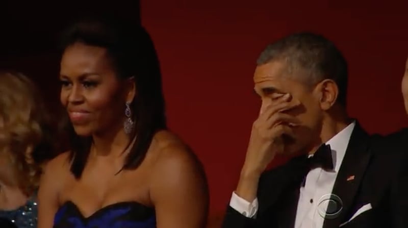 First lady Michelle Obama enjoys Aretha Franklin’s performance at the 2015 Kennedy Center Honors while President Barack Obama wipes away a tear.