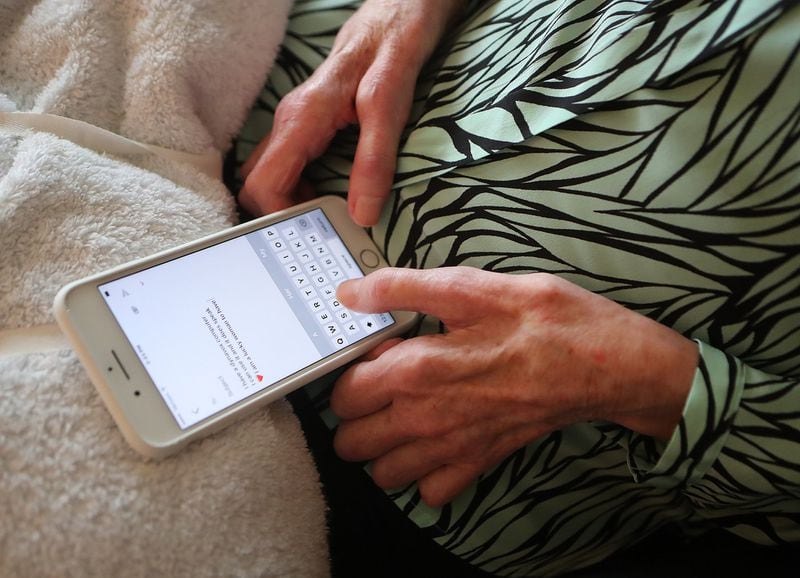 Mary Rose Taylor, once an articulate voice in the effort to battle neuro-degenerative diseases, eventually communicated by using her iPhone. Curtis Compton/ccompton@ajc.com