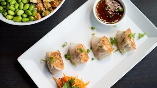 CO Pork and Ginger Gyoza dumplings with soy scallion sauce. Photo credit- Mia Yakel.