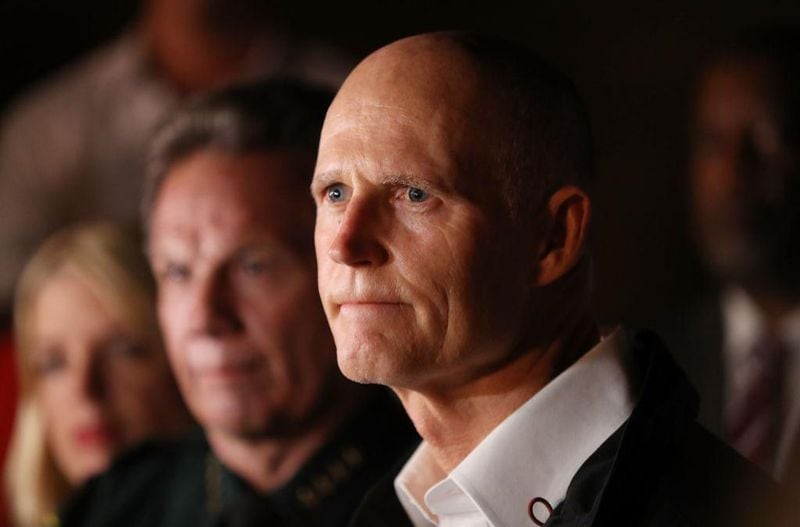 PARKLAND, FL - FEBRUARY 14:  Florida Governor Rick Scott speaks to the media as he visits Marjory Stoneman Douglas High School after a shooting at the school killed 17 people on February 14, 2018 in Parkland, Florida. Numerous law enforcement officials continue to investigate the scene.  (Photo by Joe Raedle/Getty Images)