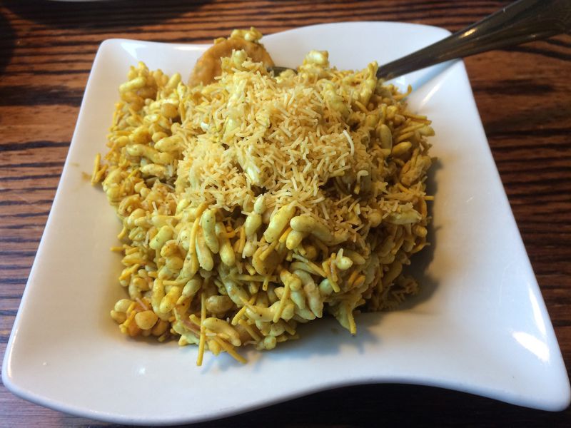 The bhel puri mix (puffed rice), a traditional Indian street food snack, is a delicious appetizer at Pinch of Spice in Kennesaw. CONTRIBUTED BY WENDELL BROCK