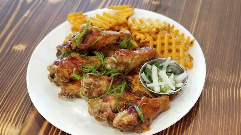 Korean fried chicken served with waffle fries at Wyer Street Foods.
