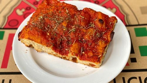 This is a slice of Ladrillo — aka grandma pie — from La Calavera Pizza. Ladrillo is the Spanish word for brick, and these heavy, red, rectangular slices do look a bit like red bricks. Wendell Brock for The Atlanta Journal-Constitution