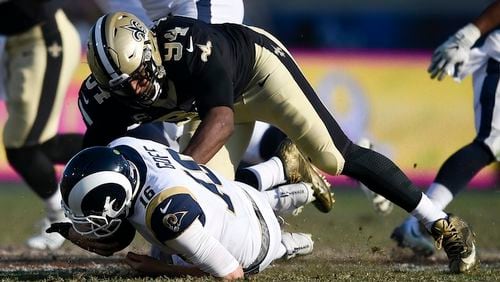 Los Angeles Rams quarterback Jared Goff, bottom, is sacked by is tackled by New Orleans Saints defensive end Cameron Jordan during the first half of an NFL football game, Sunday, Nov. 26, 2017, in Los Angeles. (AP Photo/Kelvin Kuo)
