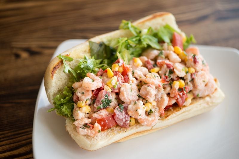 Rise and Revelry Shrimp Roll sandwich with Alabama shrimp salad, lemon mayo, and local lettuce on a hoagie roll.