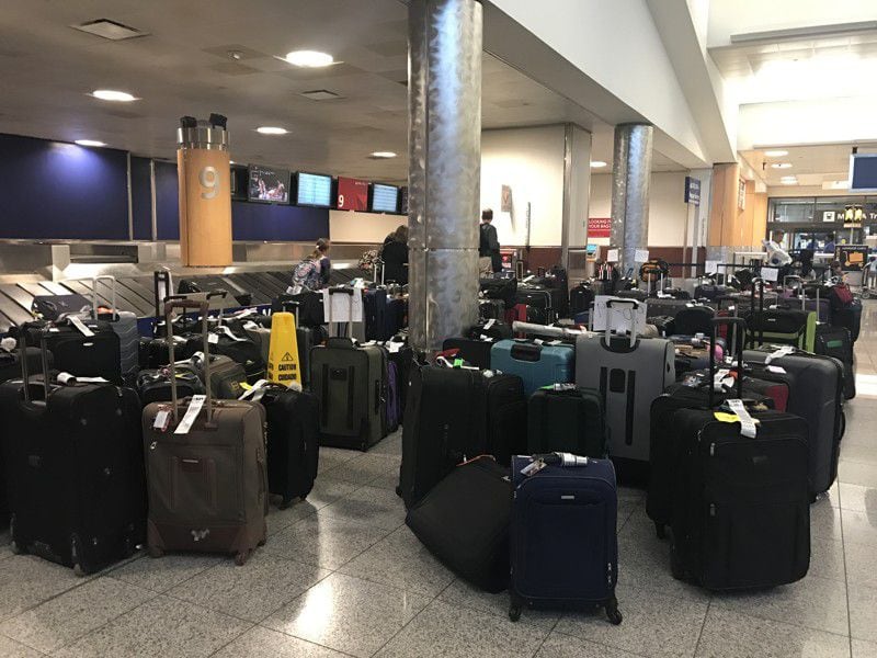 Hundreds of bags were left on the floor at Delta baggage claim at the Atlanta airport in the aftermath of the airline's thousands of flight cancellations since Wednesday.
